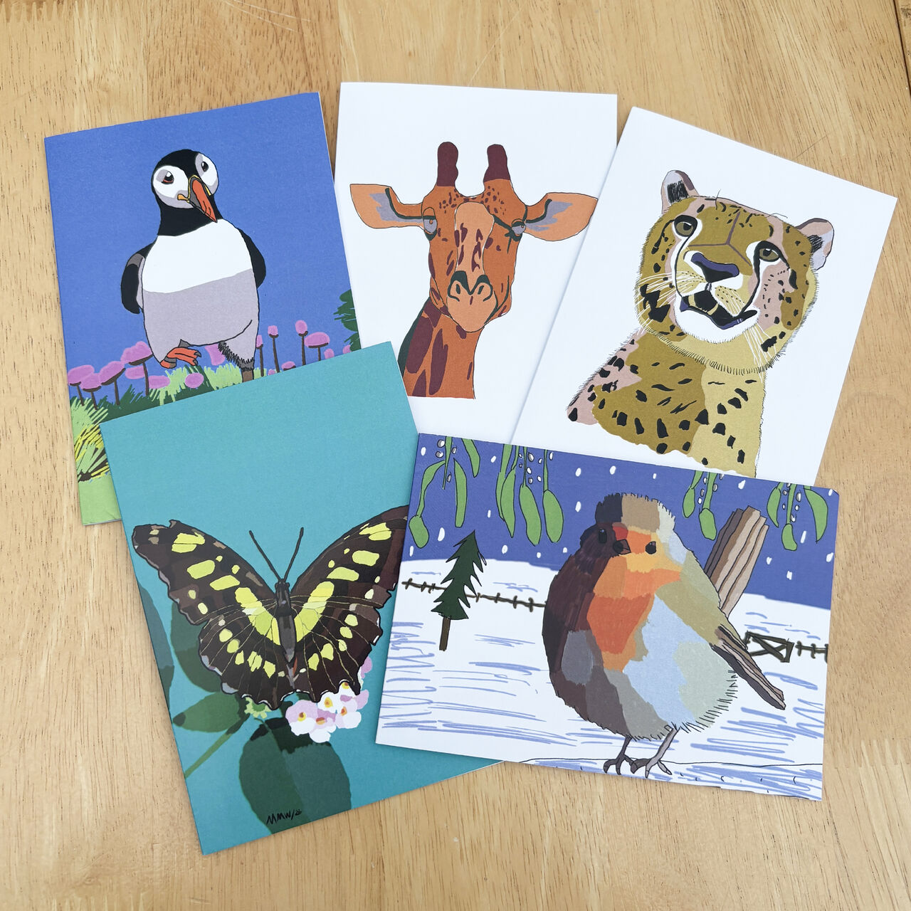 Animal inspired range of greetings cards including a puffin, cheetah giraffe, butterfly and a robin bird.